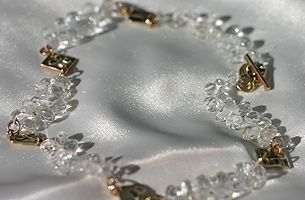 Sparkling white topaz necklet with handmade 9ct gold square motifs and a 9ct hand-made clasp.