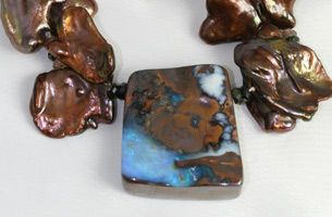 Interesting Australian boulder opal set with large, brown, cornflake-shaped, freshwater cultured pearls and semi- precious beads.